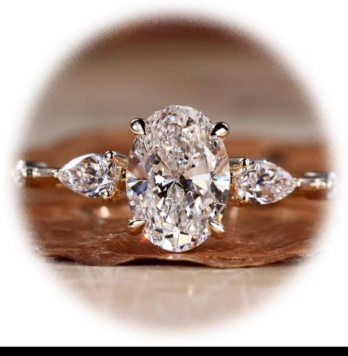 Oval Centre Stone Lab Diamond with Pear Shape Stones Either Side