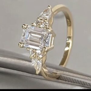 Emerald Cutlabdiamond Engagement Ring With Pear Cut Either Side